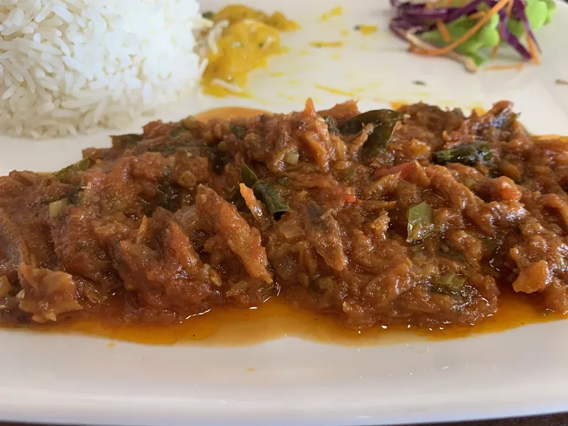Fish rougaille with rice at a restaurant in Flic en Flac
